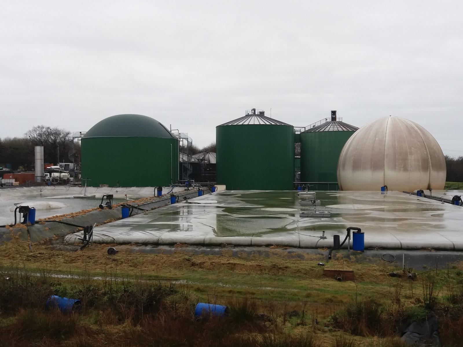 Digester tanks and a gas storage dome at an anaerobic digestion plant
