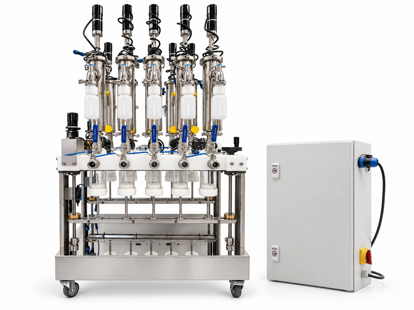 The Caterpillar ten-reactor automatically-fed array beside its PLC control cabinet